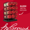 A Mccormick Spice Rack Red Cap Black Metal 12 Ct, filled with various McCormick spices like garlic salt, cumin, paprika, and basil, is displayed against a red background with text highlighting its sleek metal design.