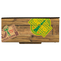 The side of a package for Mccormick, 10.49 Oz is designed to look like a wooden crate with travel-themed stickers for Logue Town and Twin Cape.