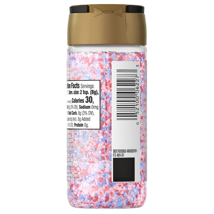 The back of a McCormick shaker bottle of Mc Mixed Berry Fin Sgr 72/6/3.15 Oz shows the nutrition facts, ingredients list, and barcode against the red, white, and blue sugar crystals inside.