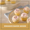 Vanilla cupcakes with white frosting are decorated with a colorful topping of Mc Mixed Berry Fin Sgr 72/6/3.15 Oz to show how it can enhance baked goods.