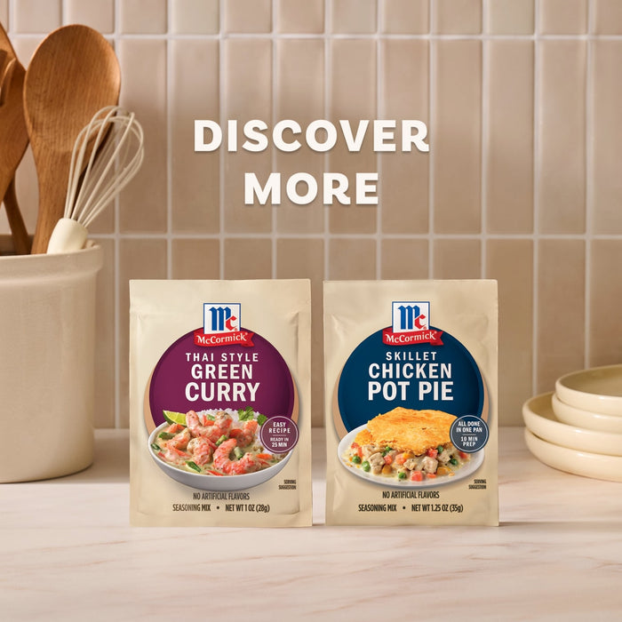 A promotional image featuring a package of Mc Thai Gn Curry Mix alongside a Skillet Chicken Pot Pie seasoning mix set against a tiled kitchen background with wooden utensils.