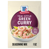 A one ounce package of Mc Thai Gn Curry Mix featuring a bowl of shrimp and vegetables in a creamy green sauce over rice.