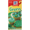 ['McCormick Green Food Color packaging with cupcakes and cookies decorated with green frosting.']