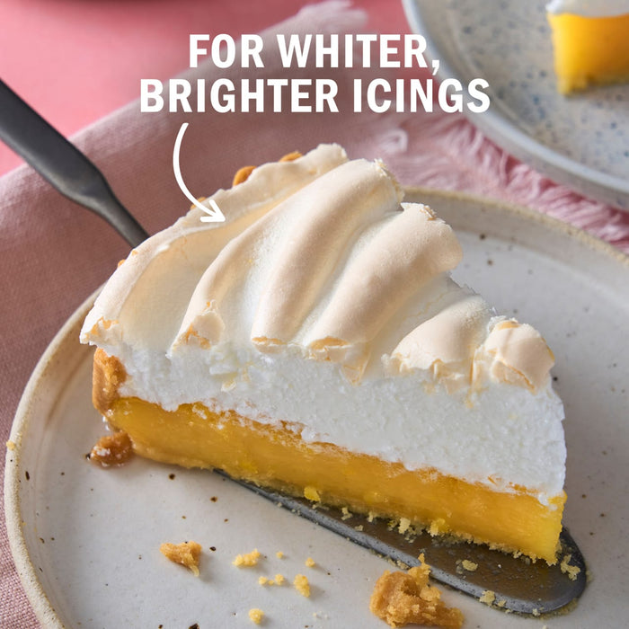 A slice of lemon meringue pie with the text For whiter brighter icings is displayed highlighting the pies appealing appearance.