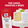 A box of McCormick Vanilla Flavor is displayed next to a cake highlighting its use for cakes frosting and more.