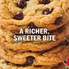 A stack of chocolate chip cookies with the text A richer sweeter bite overlaid.