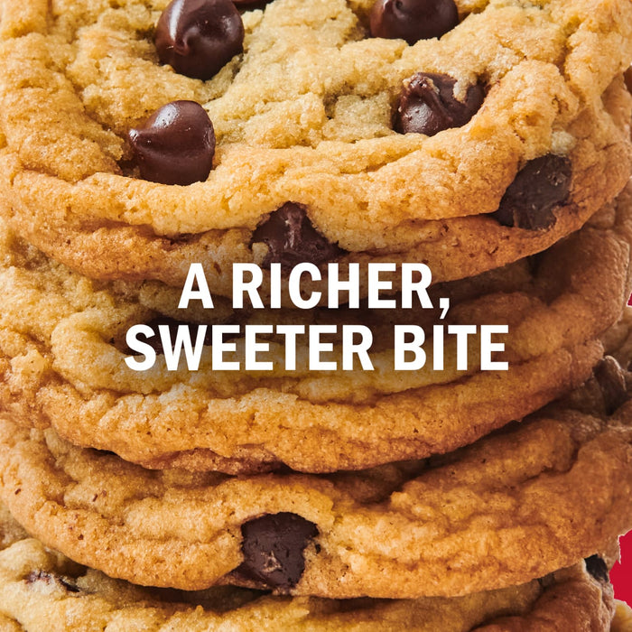 A stack of chocolate chip cookies with the text A richer sweeter bite overlaid.