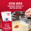 A person is adding McCormick Pure Vanilla Extract to a bowl of batter suggesting it can be used for pancakes waffles or muffins.