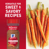 McCormick Cinnamon is versatile for sweet and savory recipes, as shown with a bottle next to glazed carrots.