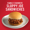 ["A sloppy joe sandwich on a white plate with the text 'Family-Favorite Sloppy Joe Sandwiches' above it."]