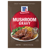 A brown and red package of Mccormick Mushroom Gravy mix shows two steaks covered in gravy with asparagus and rice, indicating it's ready in 5 minutes by just adding water.