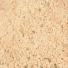 ['A close-up of a light brown, grainy mixture.']
