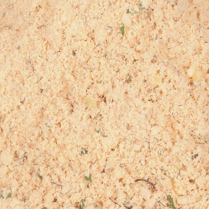 ['A close-up of a light brown, grainy mixture.']