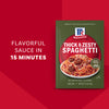 Three McCormick Thick &amp; Zesty Spaghetti sauce mix packets.