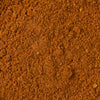 A close-up view of reddish-brown powder, which is Mccormick Chili Seasoning Mix 1.25 Oz.