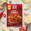 ['A package of McCormick Original Chili seasoning mix with a bowl of chili on the front.']