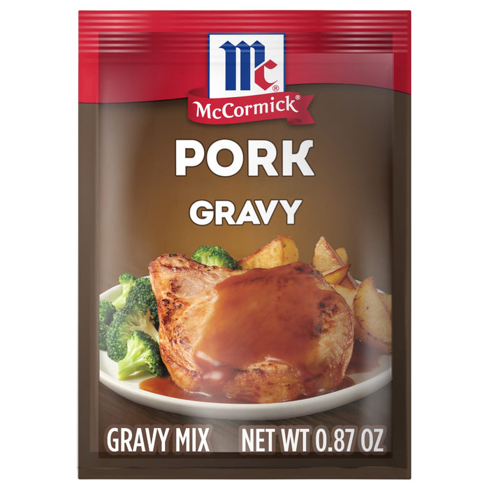 A McCormick Pork Gravy mix packet with a picture of a pork chop with gravy on top.
