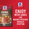 ['McCormick Pork Gravy packet with a picture of a pork chop with gravy and potatoes on a plate.']