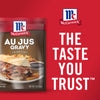 ['A McCormick Au Jus Gravy packet with a sandwich and fries on the front.']