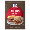 A brown packet of Mccormick Au Jus Gravy Mix 1 Oz featuring a serving suggestion of two roast beef sandwiches with a side of dipping sauce.