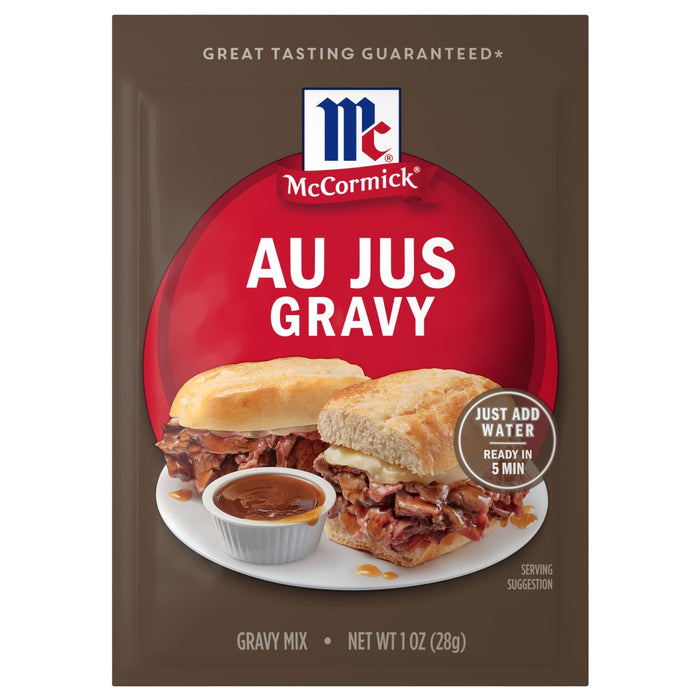 A brown packet of Mccormick Au Jus Gravy Mix 1 Oz featuring a serving suggestion of two roast beef sandwiches with a side of dipping sauce.