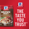 McCormick Brown Gravy package with a plate of mashed potatoes and gravy and a roast.