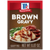 McCormick Brown Gravy mix package with a picture of mashed potatoes green beans and roast beef covered in gravy.