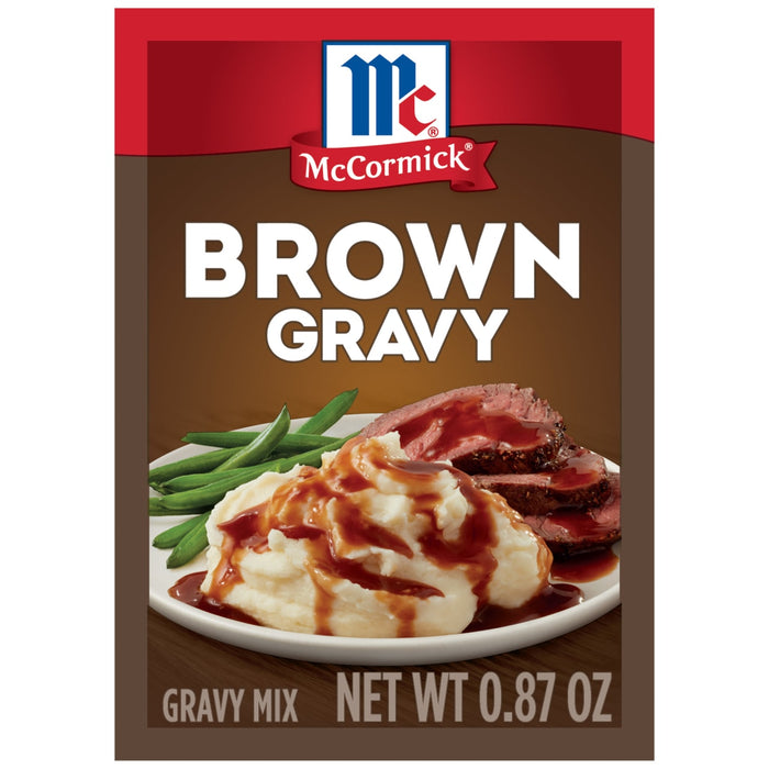 McCormick Brown Gravy mix package with a picture of mashed potatoes green beans and roast beef covered in gravy.