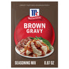 The packaging for Mccormick Brown Gravy Mix .87 Oz is displayed with a serving suggestion of the gravy poured over mashed potatoes, roast beef, and green beans.