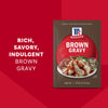 McCormick Brown Gravy mix package with a serving suggestion of mashed potatoes and gravy.