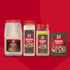Four different sizes of McCormick Brown Gravy Mix, including a large tub, two shakers, and a packet of Mccormick Brown Gravy Mix .87 Oz, are arranged against a red background.