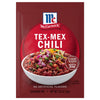 A packet of McCormick Tex-Mex Chili seasoning mix is displayed, featuring a bowl of chili topped with onions and cheese.