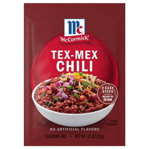 A packet of McCormick Tex-Mex Chili seasoning mix is displayed, featuring a bowl of chili topped with onions and cheese.
