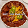 A hearty bowl of chunky beef chili topped with melted cheddar cheese and fresh jalapeño slices is prepared using Mccormick Tex Mex Chili Seasoning Mix 1.25 Oz.