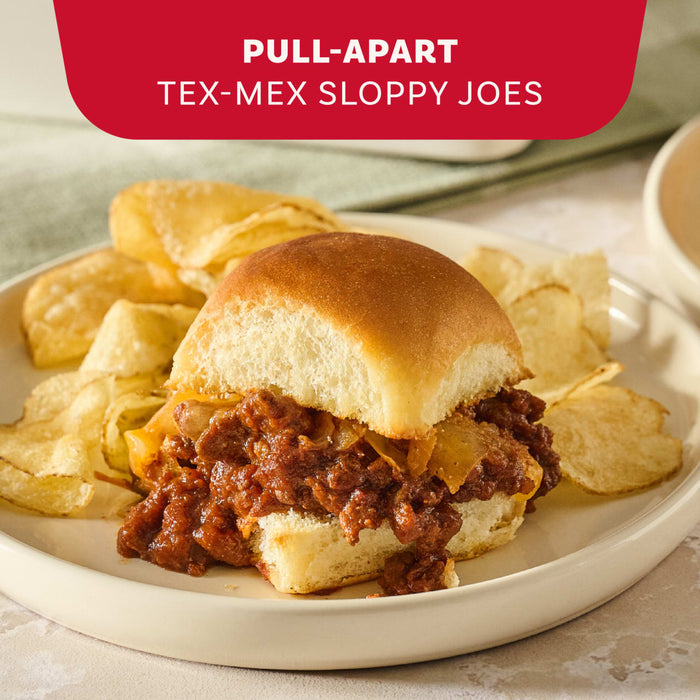 A pull-apart Tex-Mex sloppy joe slider served with a side of potato chips is seasoned with Mccormick Tex Mex Chili Seasoning Mix 1.25 Oz.