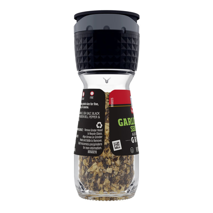 ['A McCormick Garlic Seasoning Grinder with a black lid and a clear glass body filled with garlic seasoning.']