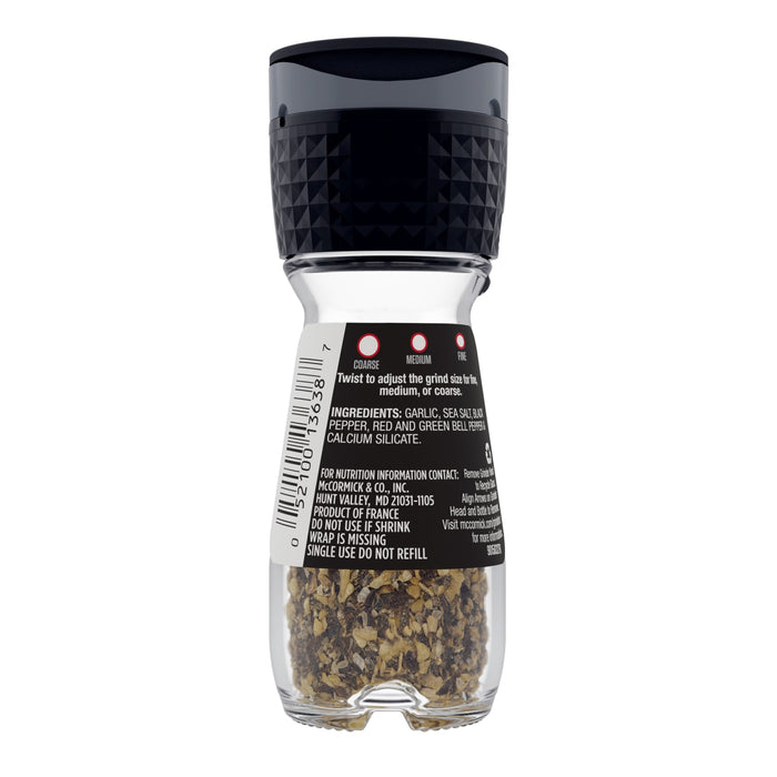 ['McCormick Gourmet Collection Black Pepper Grinder with a clear glass body and a black lid.']