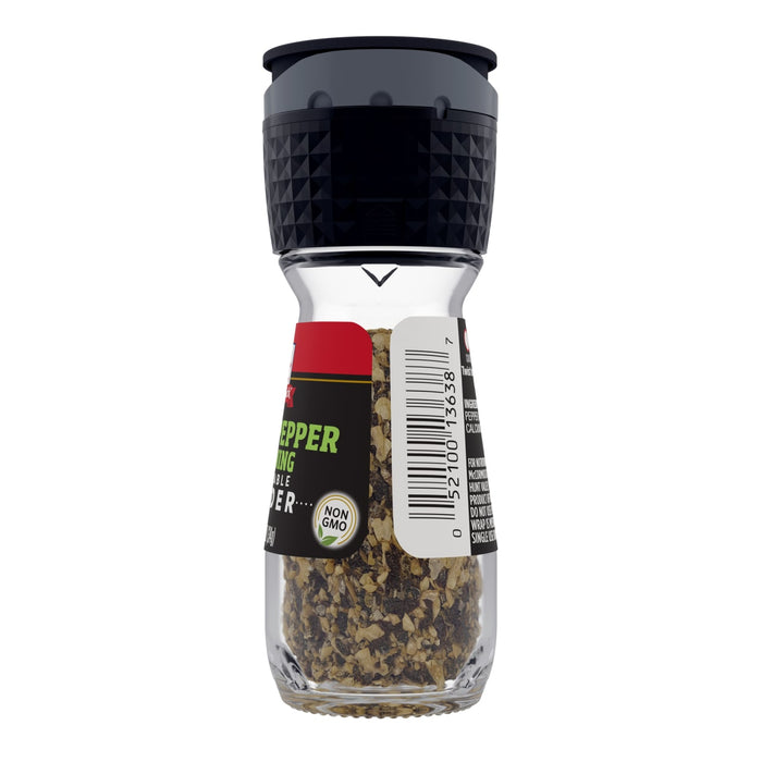 ['A glass jar of McCormick Black Pepper Grinder.']