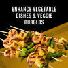 A close-up of grilled shrimp, pineapple, and green pepper skewers, suggesting a way to enhance vegetable dishes and veggie burgers.
