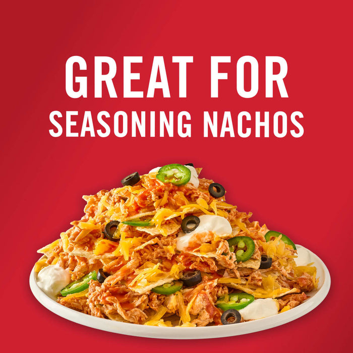 A plate of nachos with chicken cheese sour cream jalapenos and olives with the text Great for seasoning nachos above.