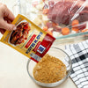["A hand pours McCormick Bag'N Season into a bowl."]