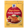 A yellow packet of Mccormick Bag N Season Regular Pork Chop Seasoning Mix &amp; Cooking Bag 1.06 Oz featuring a serving suggestion of a glazed pork chop with mashed potatoes and green beans.