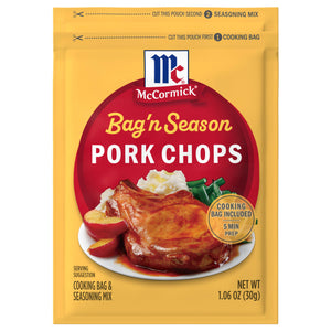 A yellow packet of Mccormick Bag N Season Regular Pork Chop Seasoning Mix &amp; Cooking Bag 1.06 Oz featuring a serving suggestion of a glazed pork chop with mashed potatoes and green beans.