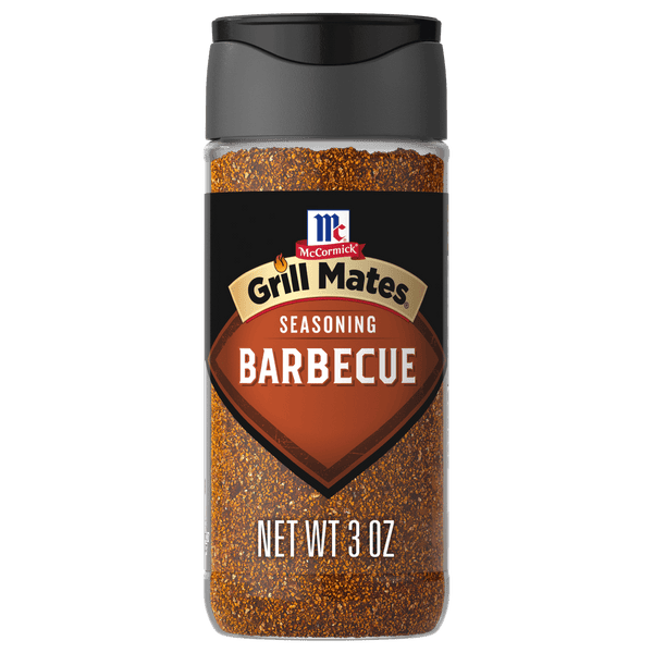 A clear plastic bottle of Mccormick Grill Mates Barbecue Seasoning, featuring a black label with the brand logo and product name, filled with reddish-brown spice.