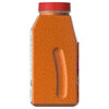 A side view of a large, clear container of Mccormick Taco Seasoning Mix 24 Oz, showing the orange-red granular spice and an indented grip.