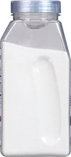 A clear plastic container filled with white powder.