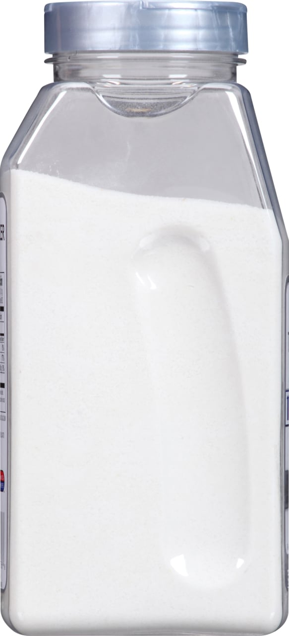 A clear plastic container filled with white powder.