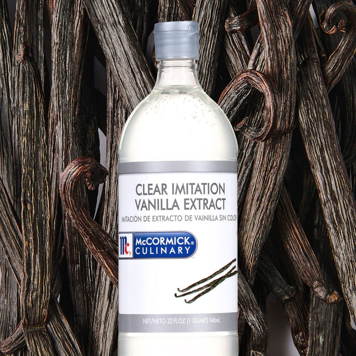 A bottle of McCormick Culinary Clear Imitation Vanilla Extract surrounded by vanilla beans.