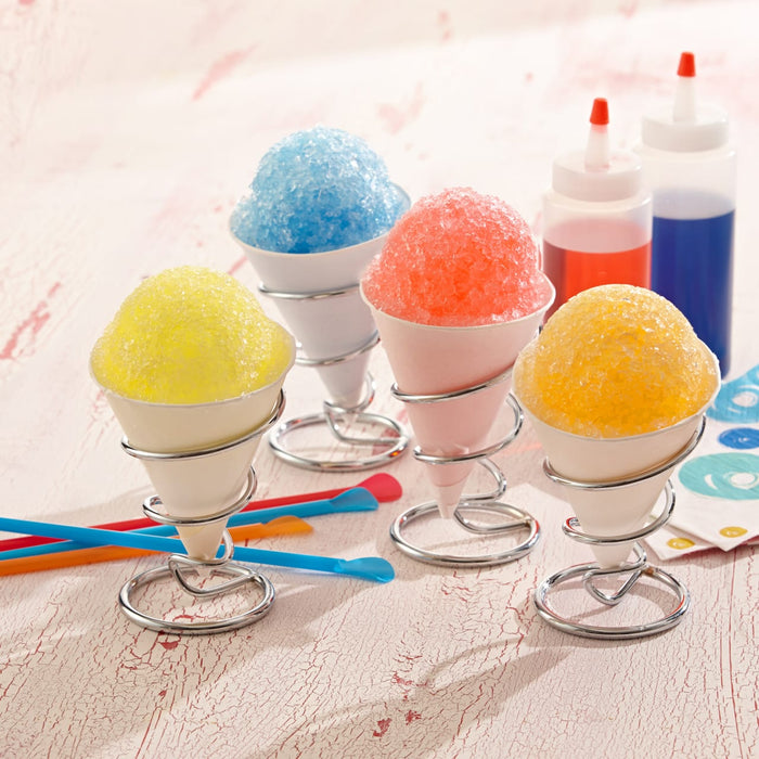 The image features four vibrant snow cones in yellow, blue, red, and orange, with squeeze bottles of syrup including Mccormick Culinary Blue Food Coloring, and colorful spoons on a light, textured surface.