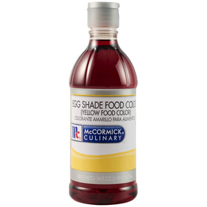 A bottle of Mccormick Culinary Egg Yellow Food Coloring 16 Oz is shown against a white background, with its label identifying the dark red liquid as yellow food coloring.